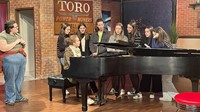 French Exchange student playing piano