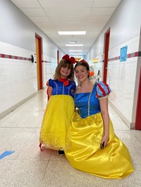 student and teacher dressed up as snow white