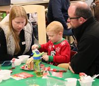 students and family members at pre-K family day