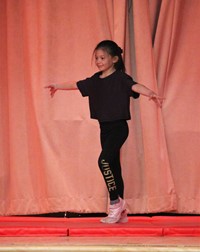 student participating in talent show