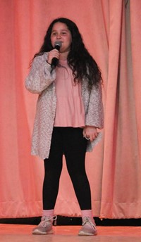 student participating in talent show