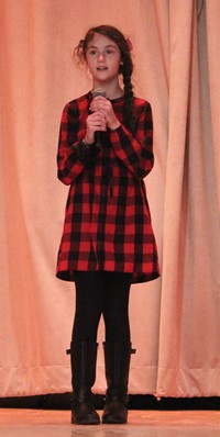 student participating in talent show