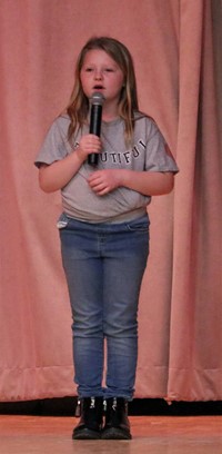 student participating in talent show