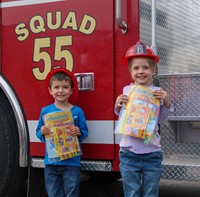 students at firetruck booth