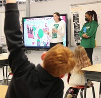 Binghamton University Athletes reading to Port Dickinson Elementary students