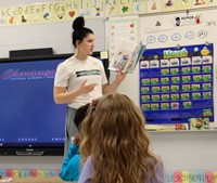 Binghamton University Athletes reading to Port Dickinson Elementary students