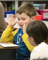 Binghamton University Athletes reading to Port Dickinson Elementary students