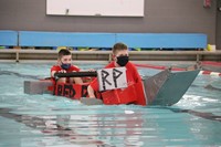 students participating in cardboard boat races