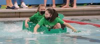 students participating in cardboard boat races