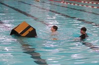 students participating in cardboard boat races