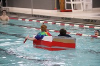 students participating in cardboard boat races