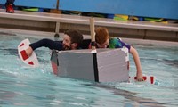 students participating in cardboard boat races