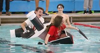 students participating in cardboard boat races