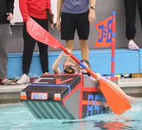 students participating in cardboard boat races