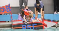 students participating in cardboard boat races