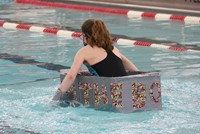 students participating in cardboard boat races