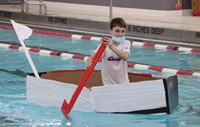 students participating in cardboard boat races