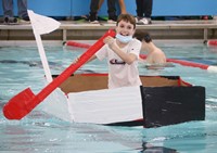 students participating in cardboard boat races