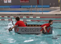 students participating in cardboard boat races