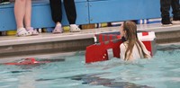 students participating in cardboard boat races