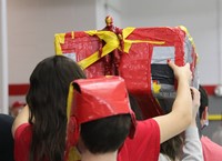 students participating in cardboard boat races