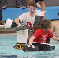 students participating in cardboard boat races