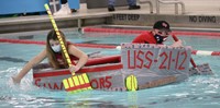 students participating in cardboard boat races