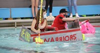 students participating in cardboard boat races