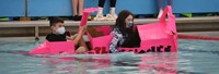 students participating in cardboard boat races