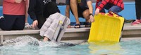 students participating in cardboard boat races