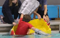 students participating in cardboard boat races