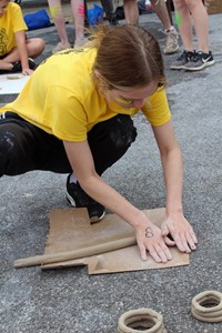 student working on feats of clay activity