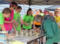 judge looking at clay creations