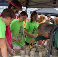 judge looking at clay creations