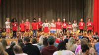 first grade students singing at sing along event