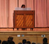 student playing piano at talent show