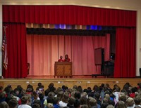 student singing and student playing piano at talent show