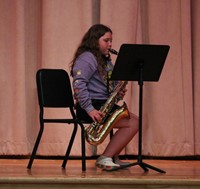 student playing saxophone