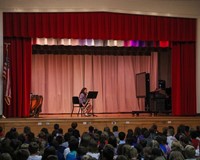 student playing saxophone