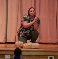 nurse showing heimlich maneuver