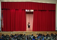 student hosting talent show