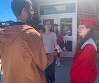 salutatorian being interviewed by reporters