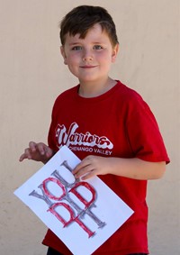 student holding you did it sign