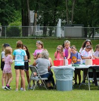 students getting temporary tattoos