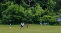 students playing kickball