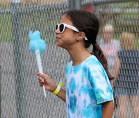 student holding cotton candy