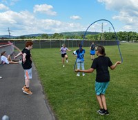 students participating in sixth grade field day event