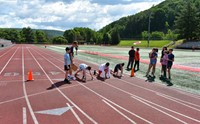 students participating in sixth grade field day event