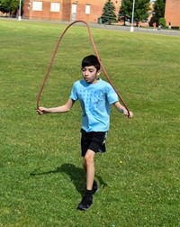 students participating in sixth grade field day event