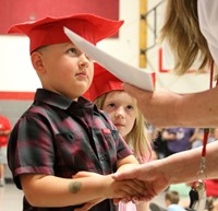 students at kindergarten graduation